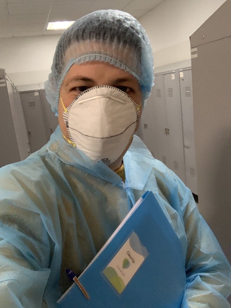 a person wearing a mask and hair net